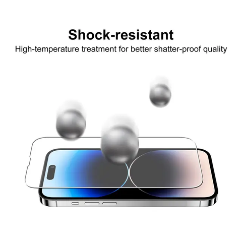 Abgebildet ist ein HandyOase Panzerglas iPhone 3er-Set, das ein Smartphone schützt, während Metallkugeln darüber hüpfen, und so seinen stoßfesten und bruchsicheren Bildschirmschutz hervorhebt.